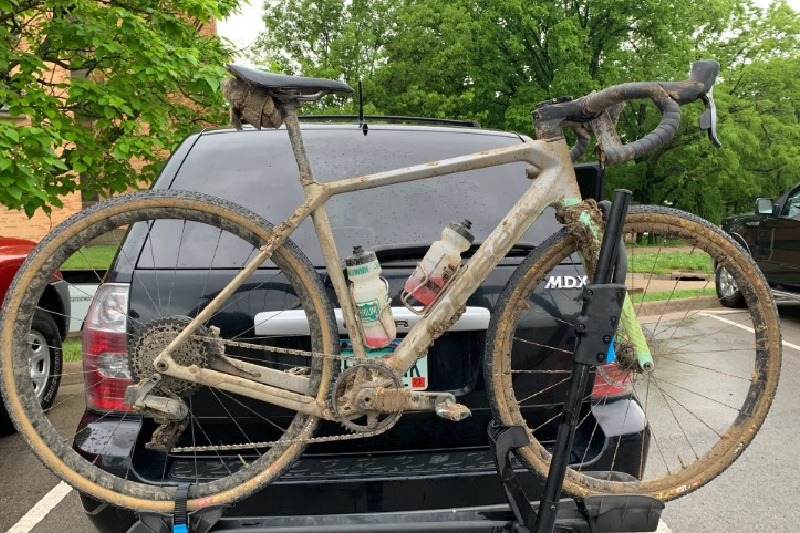 muddy bike on car ready to clean